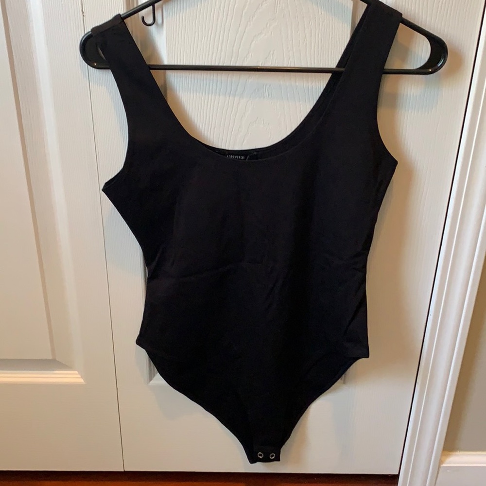 NWT. Black and white bodysuits. Never worn